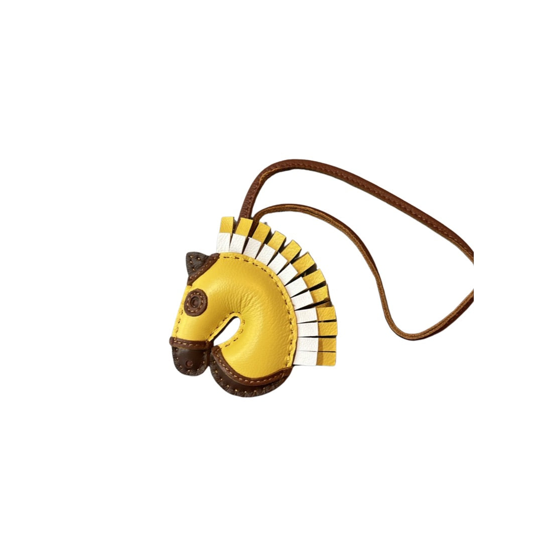 YELLOW AND WHITE HORSE CHARM